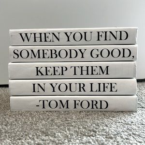 Five stackable books (black and white) to add to your living room decor.